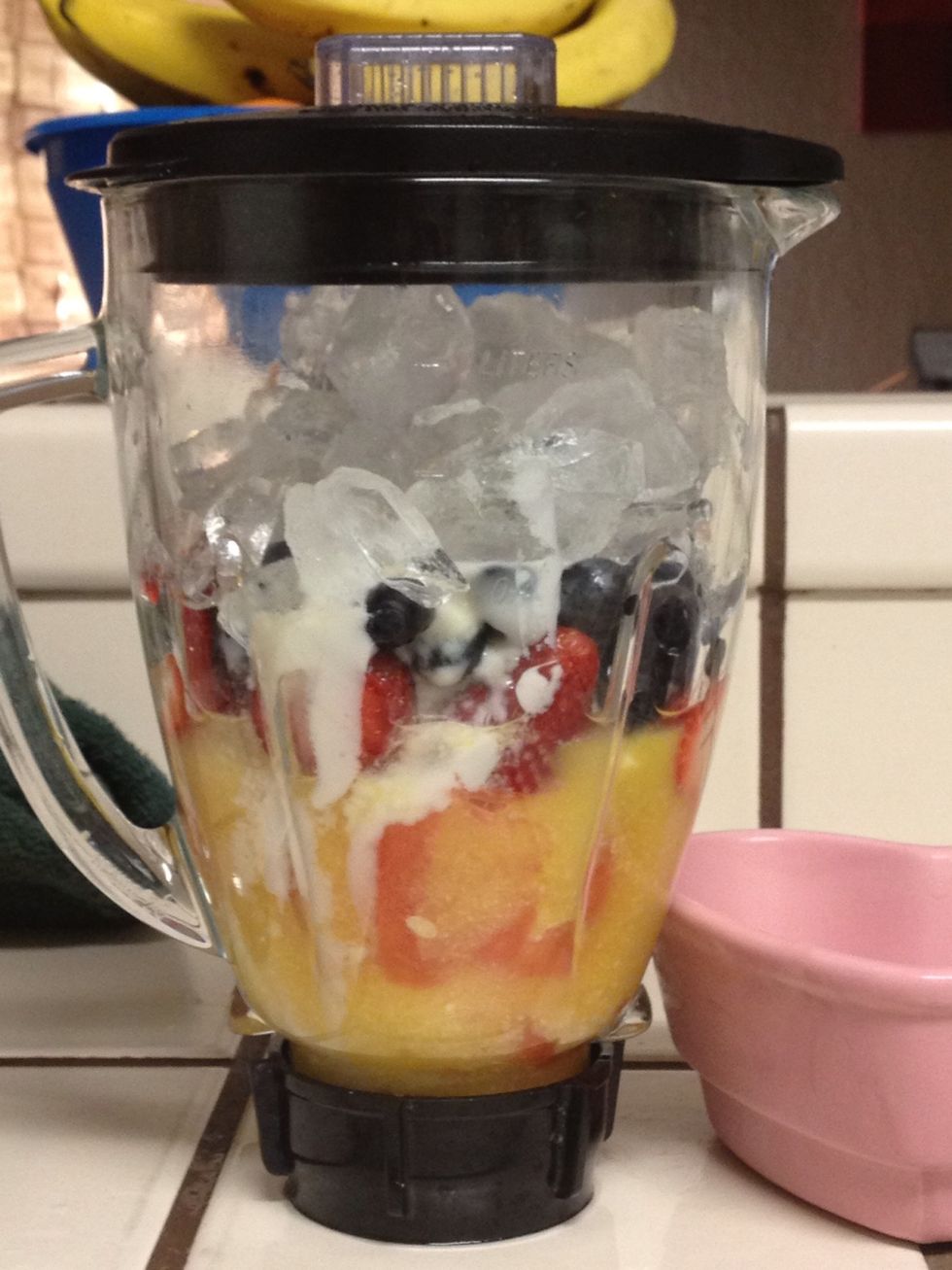 Add 1 cup of orange juice and 1 cup of ice cubes