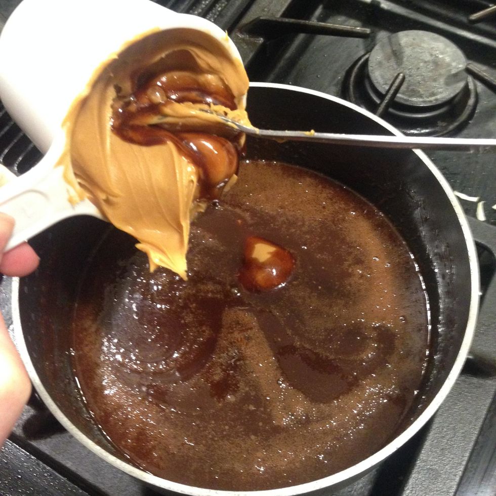 Add 1 cup of peanut butter to the mixture. Creamy peanut produces more moist cookies, but crunchy peanut butter can work too.