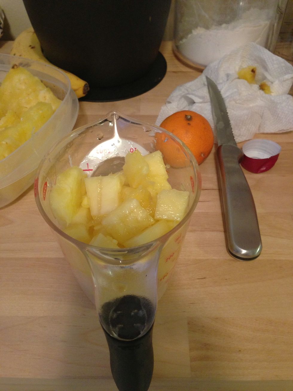 Add 1 cup of pineapple, 1 mango, orange, and any other desired fruits to the wine mixture. Apple also goes well in sangria, but this is just the fruit I had on hand.
