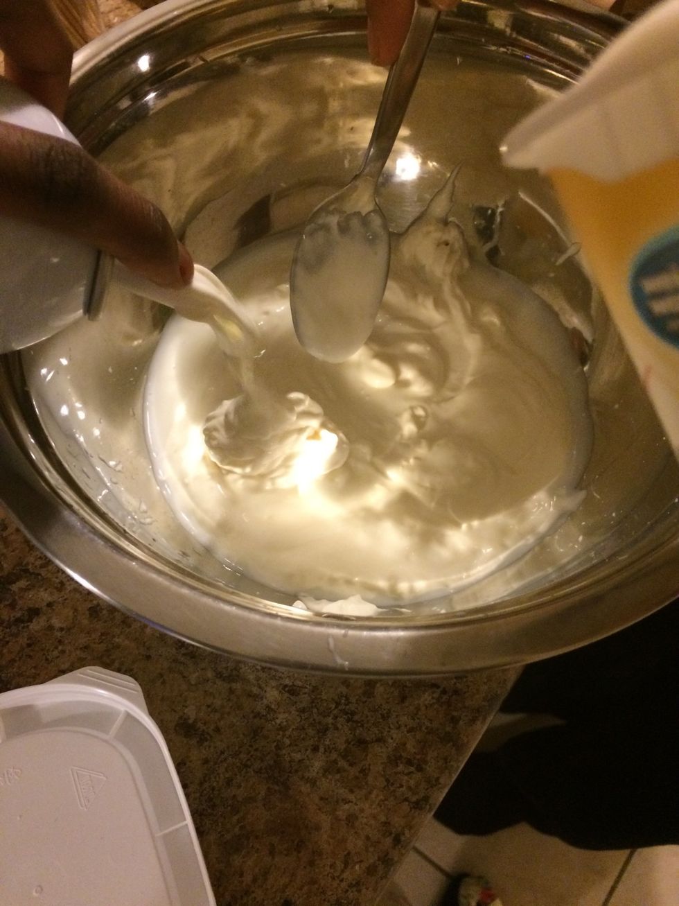 Add 1 cup of yogurt to the bowl as well as a half cup of whip cram me mix the two until complete. Continue on to put the mixture in the freezer for about 15 minutes.