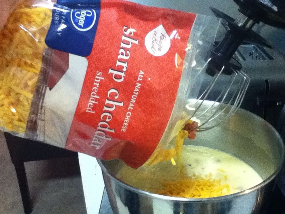 Add 1 cup shredded sharp cheddar cheese.
