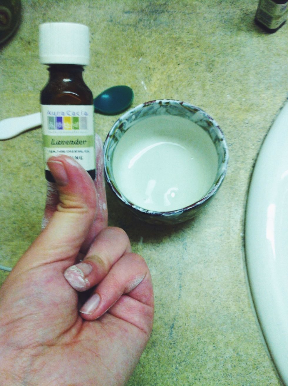 Add 1 drop of the lavender; it is a calming, natural antiseptic and helps reduce irritation and redness in skin. Add 2 drops of the rosemary; it works similarly to lavender, and is great for acne