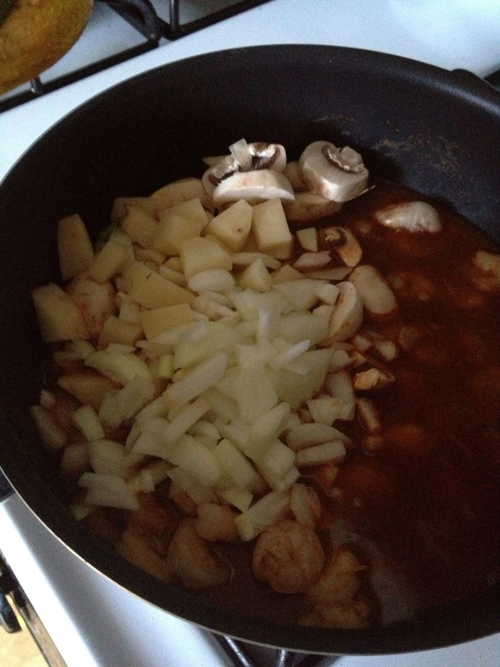 Add 1 glass of water and add potato cube, and mushroom, simmer for 10 minutes with small heat. Add coconut flake then ready to serve.