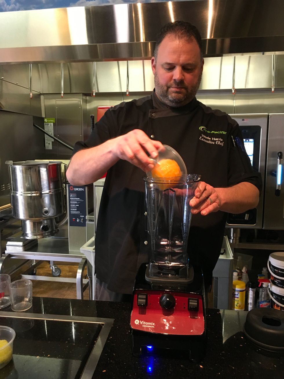 Add 1 orange (peeled and halved) to the container.