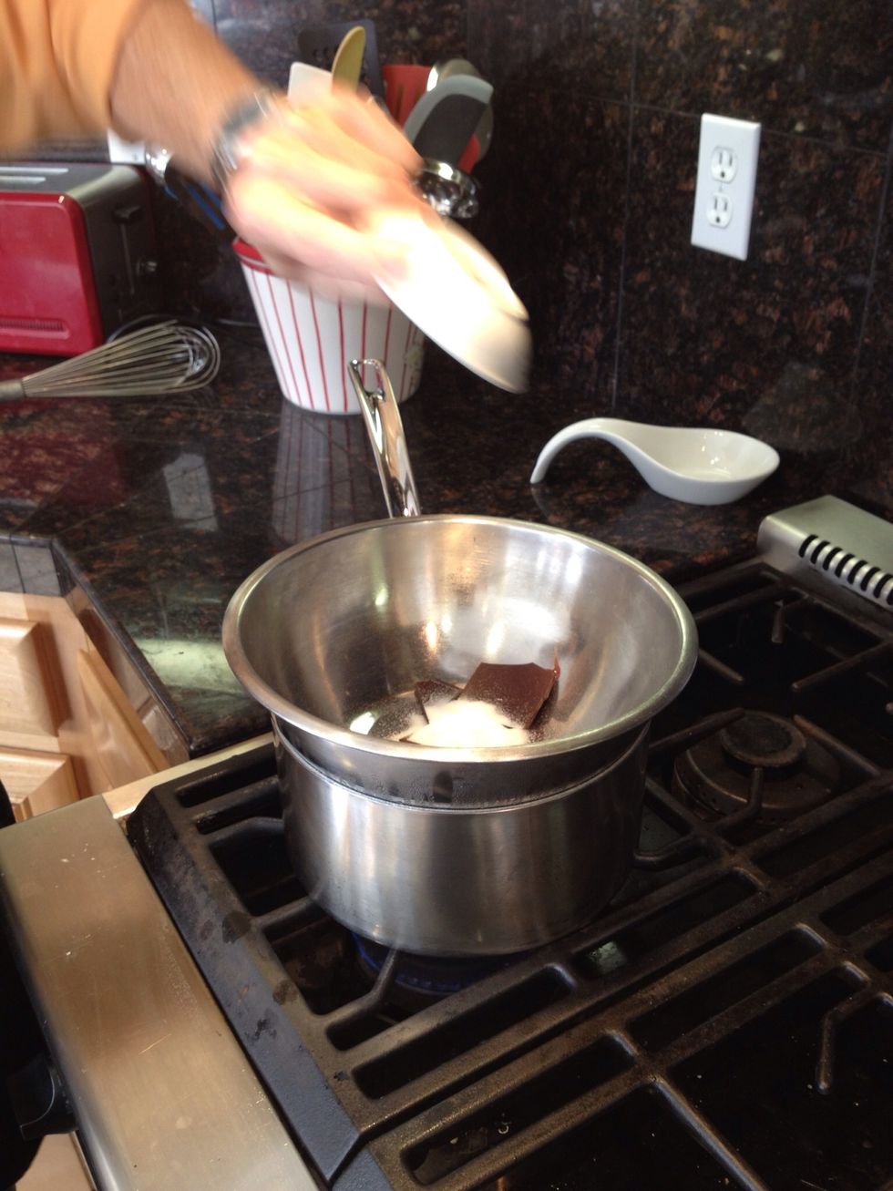Add 1 ounce of the bittersweet chocolate, the brown sugar, and the corn syrup to the double boiler. The corn syrup helps stabilize the chocolate.