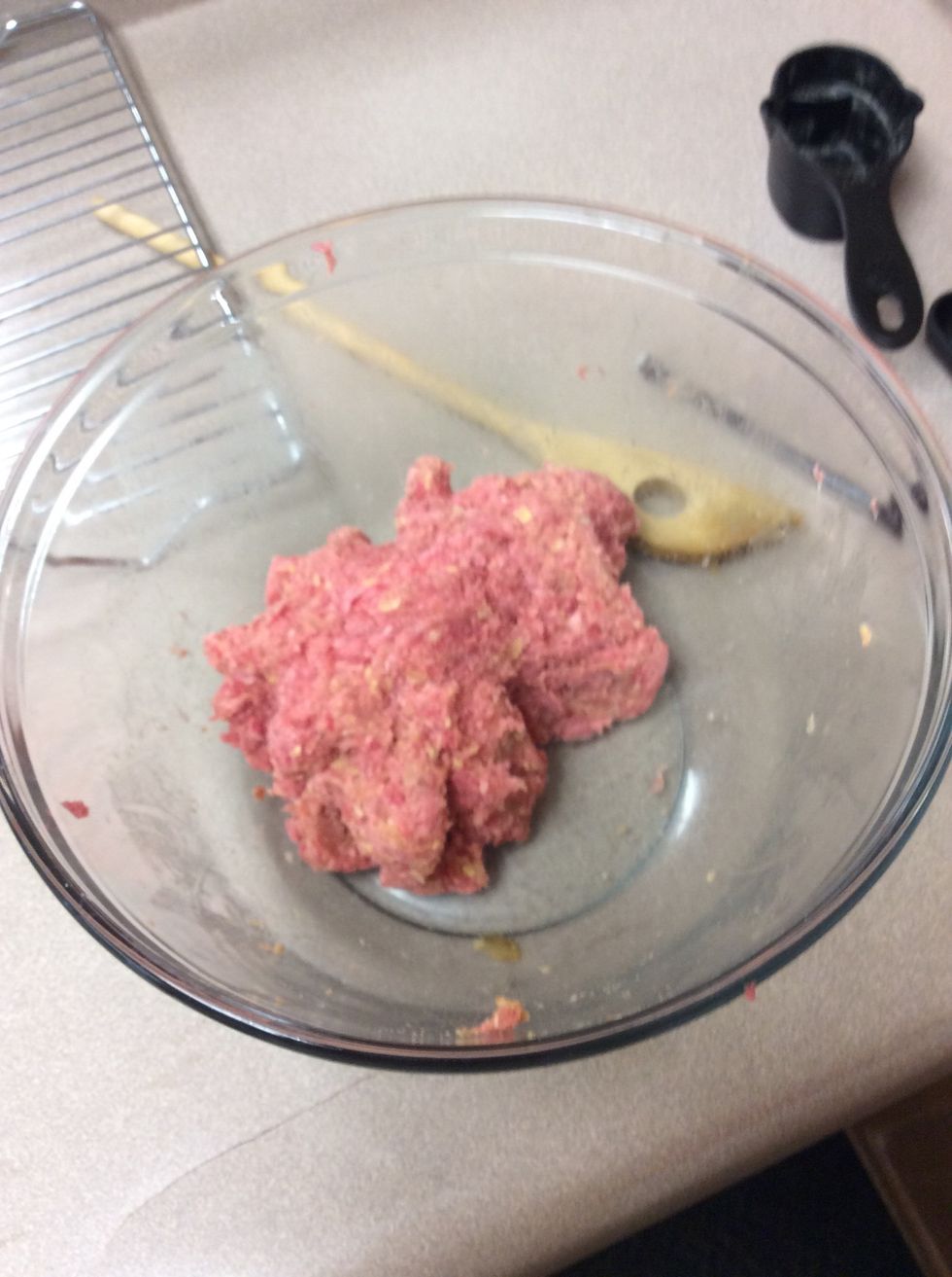 Add 1 pound of ground beef and mix with your hands