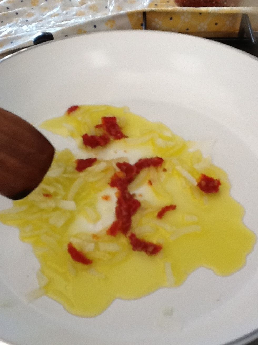 Add 1 spoon and an half of olive and let it go.