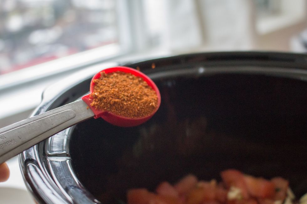Add 1 tablespoon chipotle powder and 1 tablespoon cumin  into the slow cooker