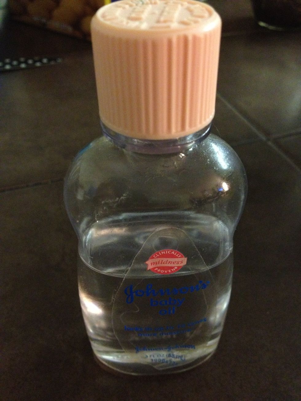Add 1 tablespoon of baby oil to the mixture and stir until all is combined.
