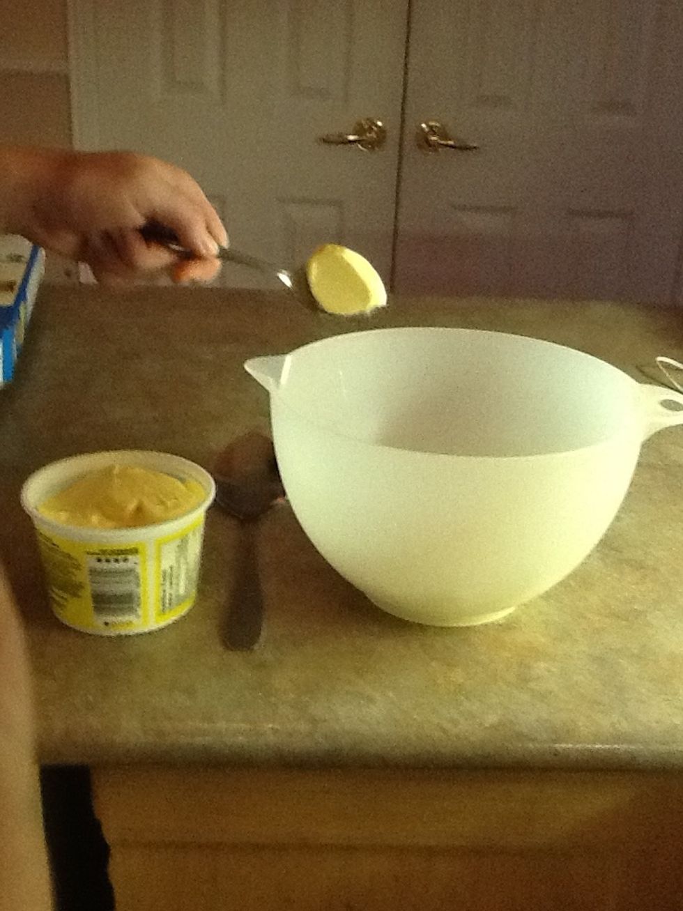 Add 1 tablespoon of margarine into bowl with marshmallows