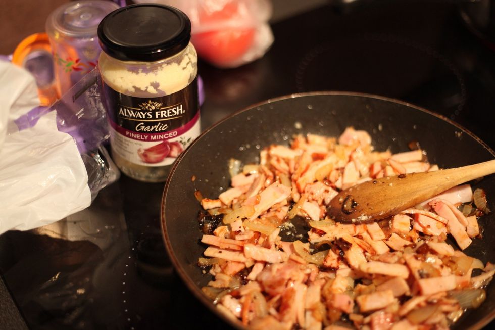 Add 1 tablespoon of minced or crushed garlic. We added the garlic now as we don't want to fry the garlic, just cook it for that extra garlic kick.