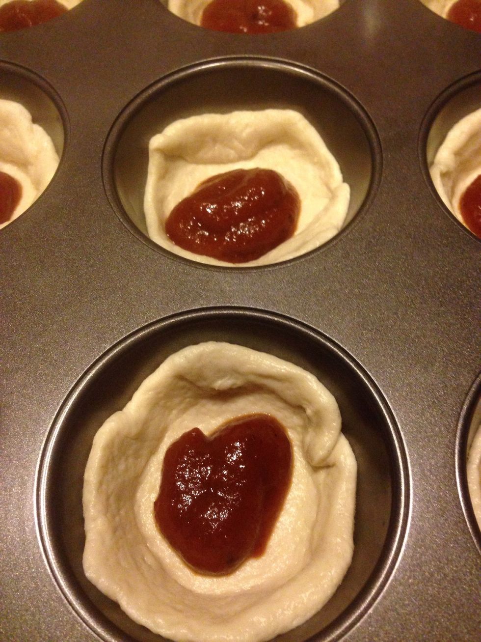 Add 1 tablespoon of pizza sauce (add red pepper chili flakes for taste to spice it up).