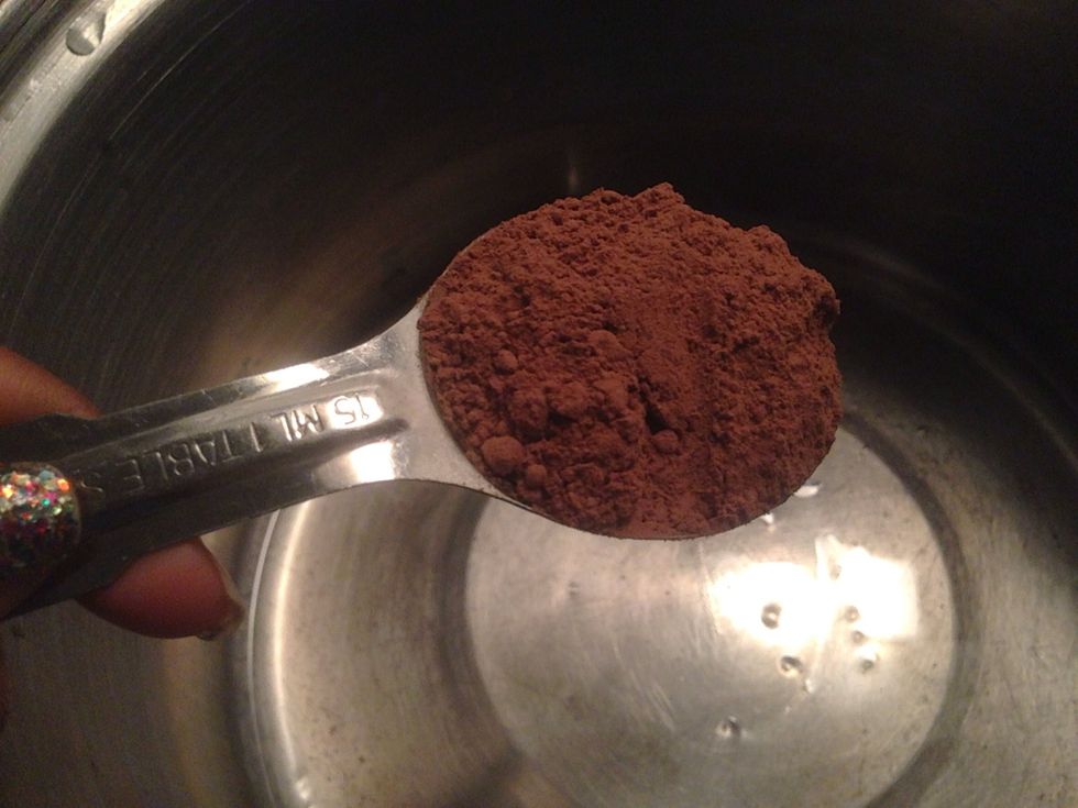 Add 1 tablespoon unsweetened organic cocoa powder to the pot with coconut oil. Stir until mixed well.