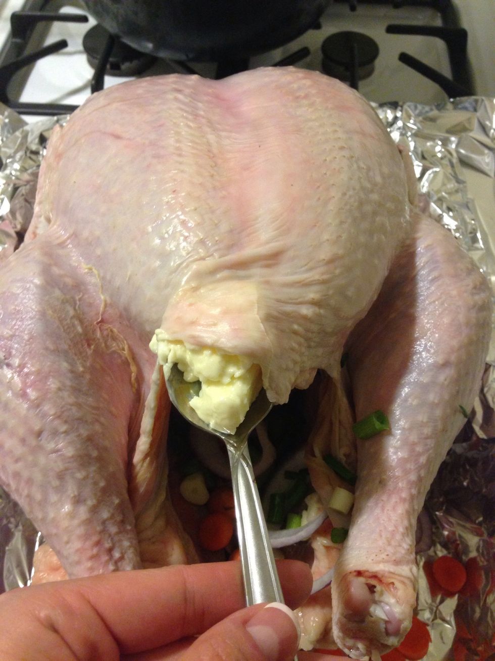 Add 1 Tbsp of butter underneath the skin. This will help the breast not overcook. Smooth the butter underneath all of the skin. I used the spatula to help.