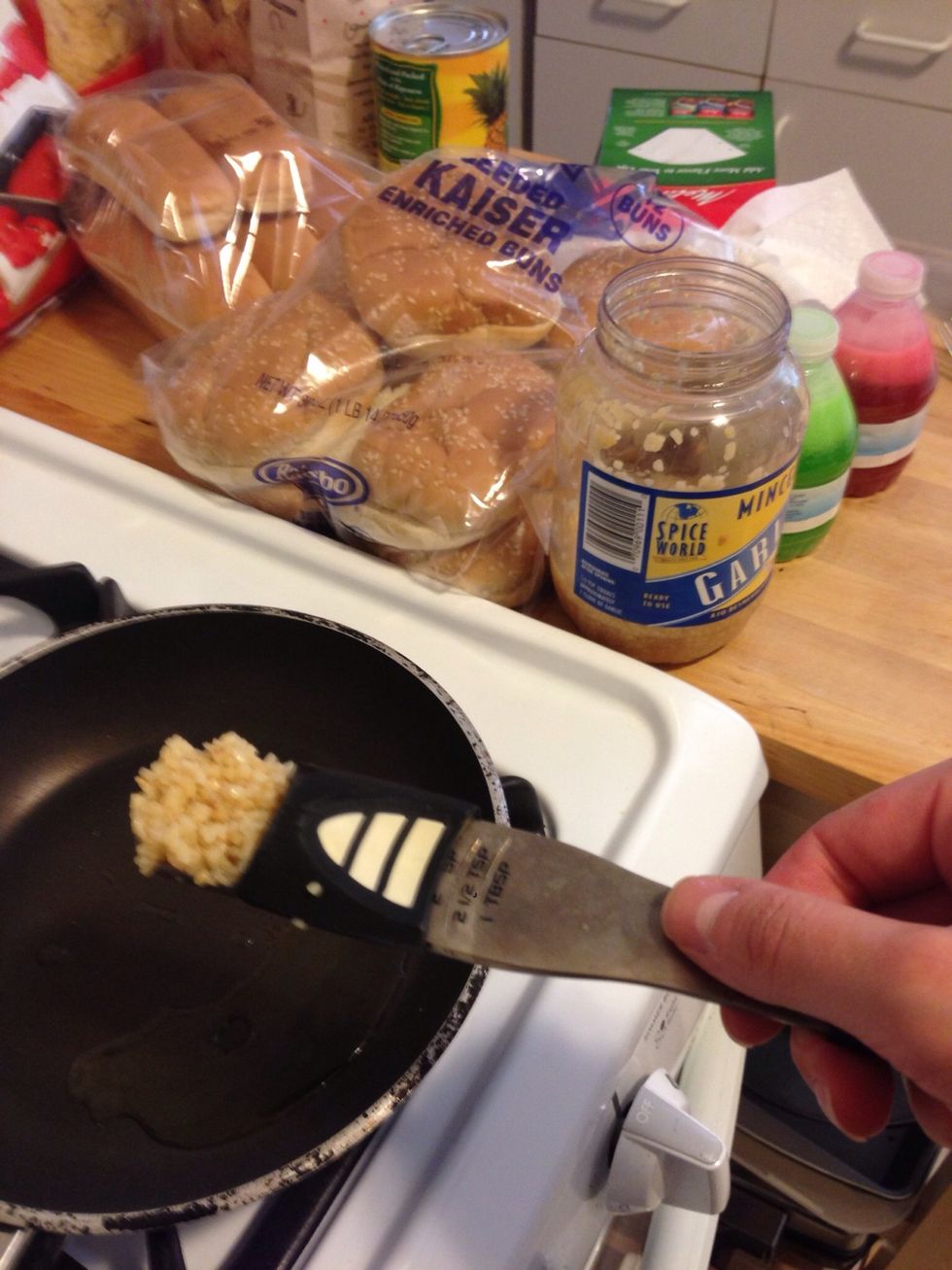 Add 1 tbsp of minced garlic to the hot oil.