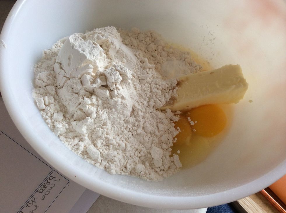 Add 1 teaspoon of baking powder into the bowl.