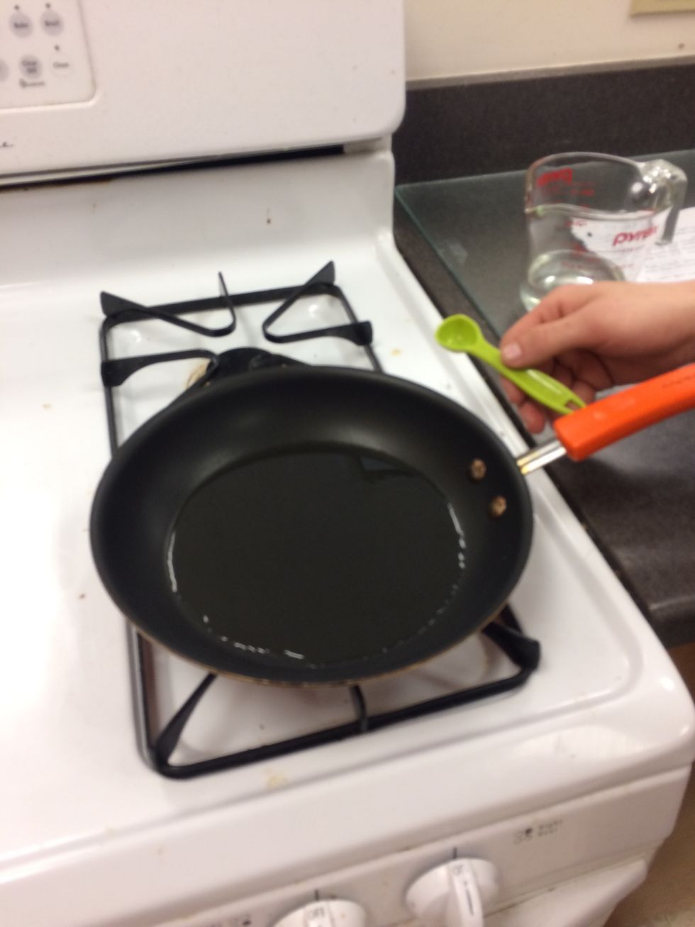 Add 1 teaspoon of canola oil to pan and heat
