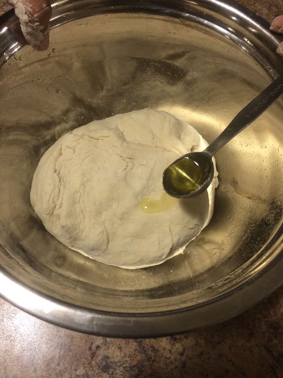 Add 1 teaspoon of olive oil to the mixed dough