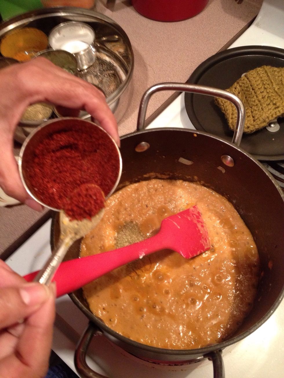 Add 1 teaspoon of red pepper (laal mirch).