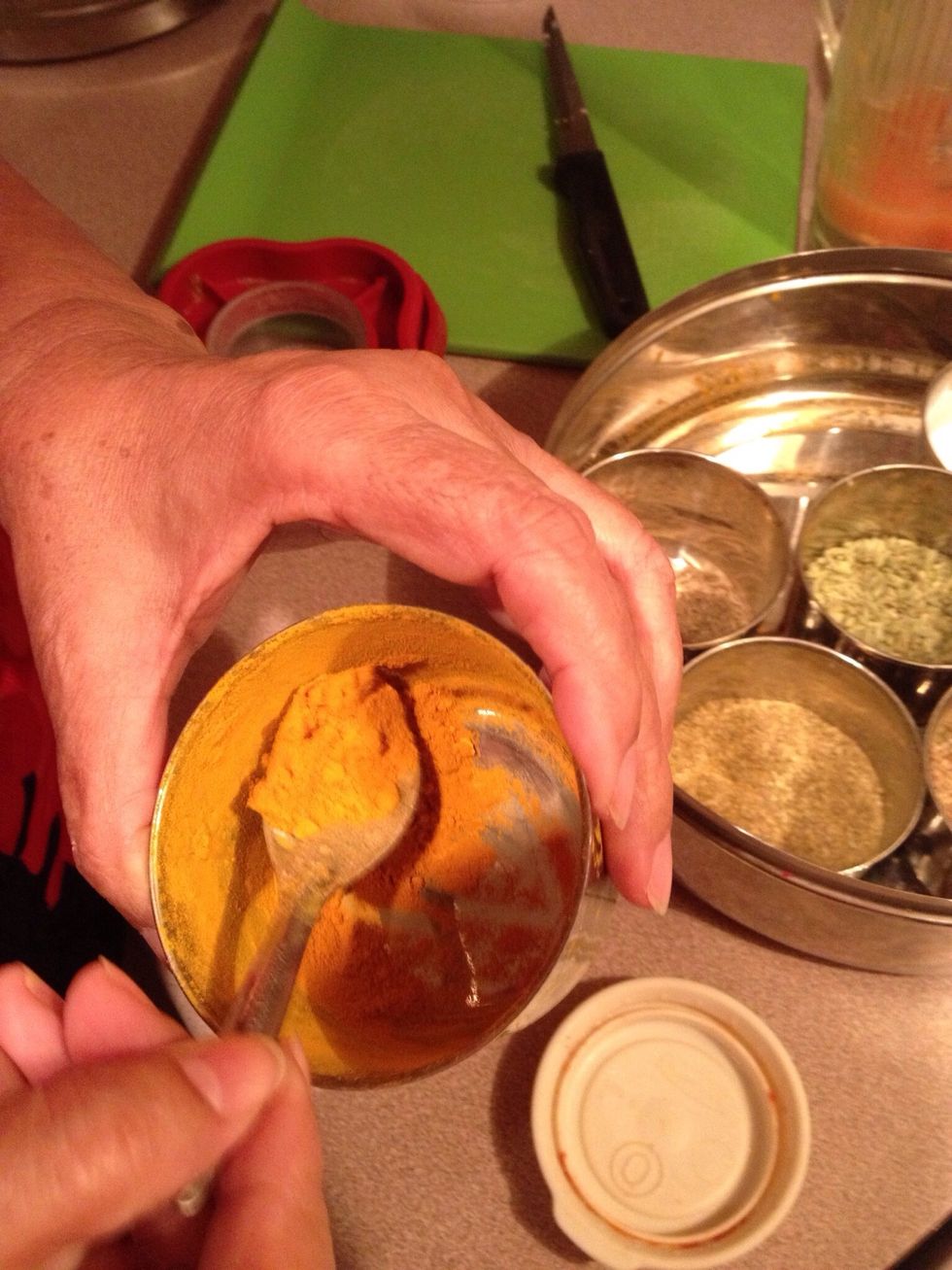 Add 1 teaspoon of turmeric (haldi).