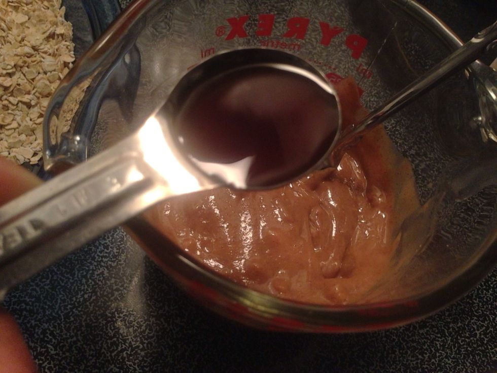 Add 1 teaspoon of vanilla extract to measuring cup and stir well
