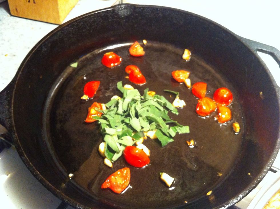 Add 1 to 2 T. Olive oil into frying pan over Medium Flame... Add garlic, sage & tomatoes and simmer until tomatoes begin to break down... 8 to 10 min.... During this time clean and trim you beans up..