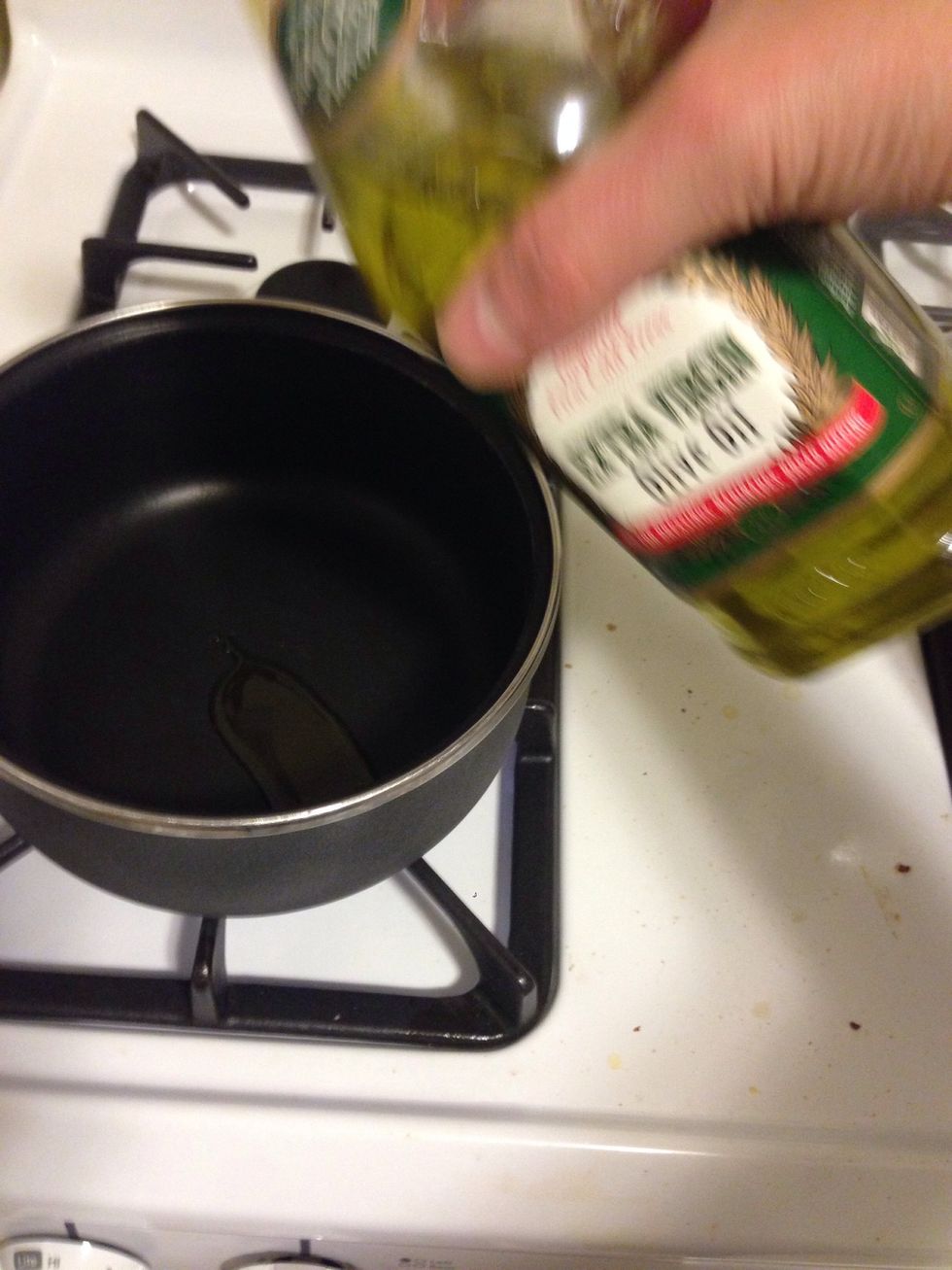 Add 1 tsp of olive oil into a separate pan and turn the heat on high. (Sorry for blurry photo)