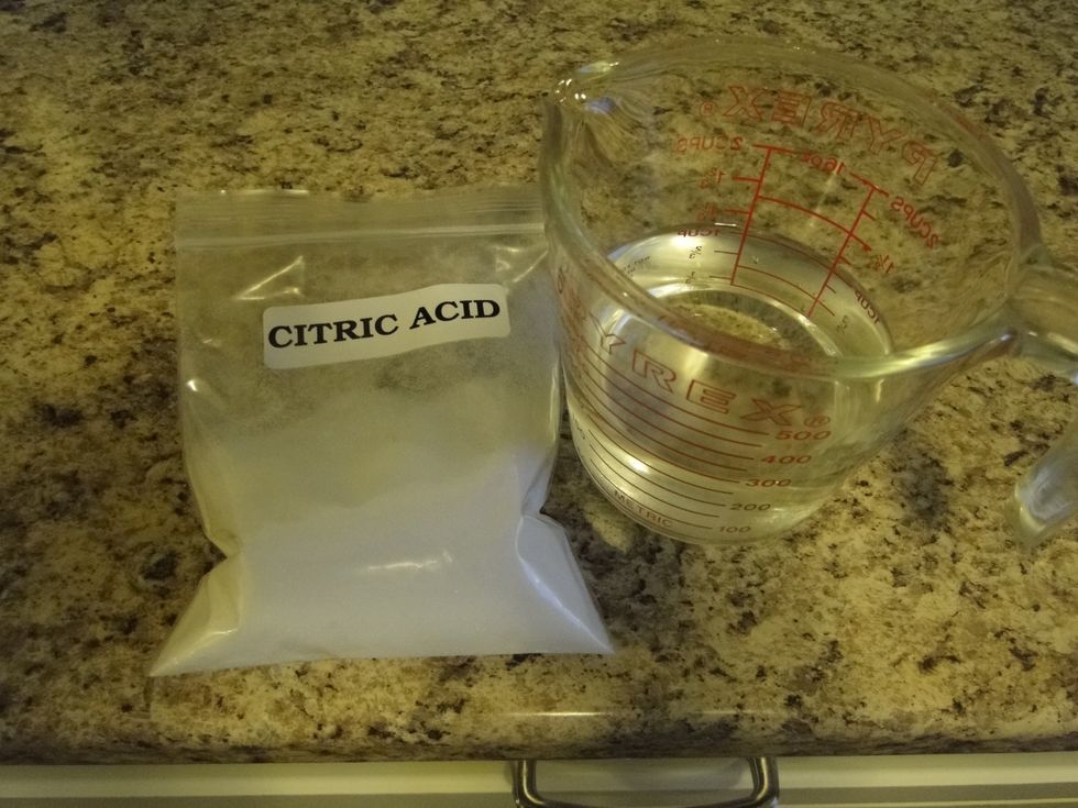 Add 11/2 teaspoons of citric acid to 1 cup water( non chlorinated) and add to milk. Some coagulation of the milk will occur right away.