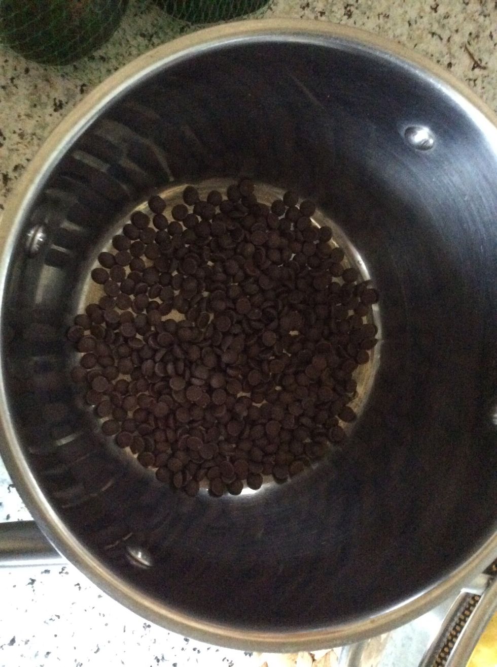 Add 150g of dark chocolate into a sauce pan and leave it on low heat until it melts.