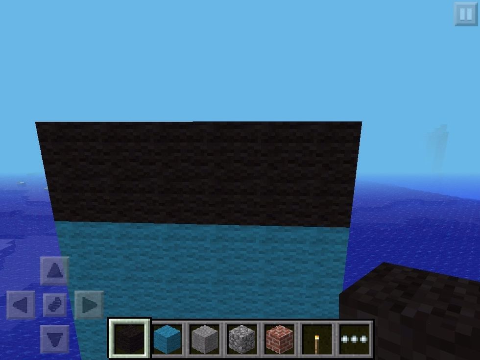 Add 2 blocks of black wool (or whatever you want for his T-shirt)