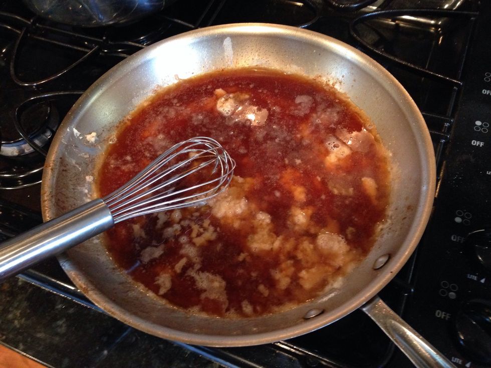 Add 2 cups of beef broth to the roux and deglaze the pan.