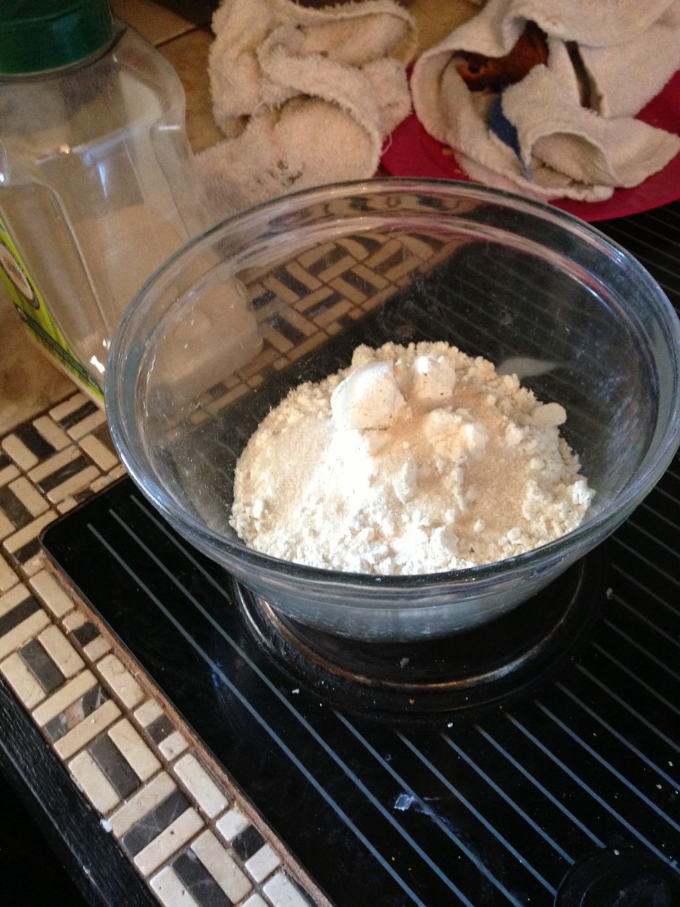 Add 2 cups of flour to bowl. Sprinkle with organic sugar.