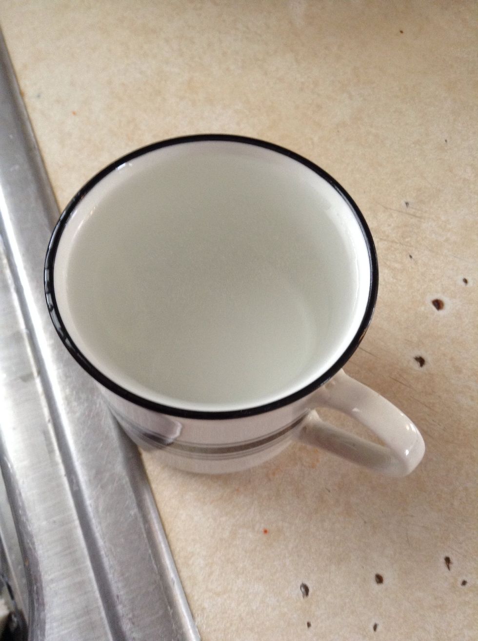 Add 2 cups of hot water to the rice... Be careful you don't get burnt from the steam.