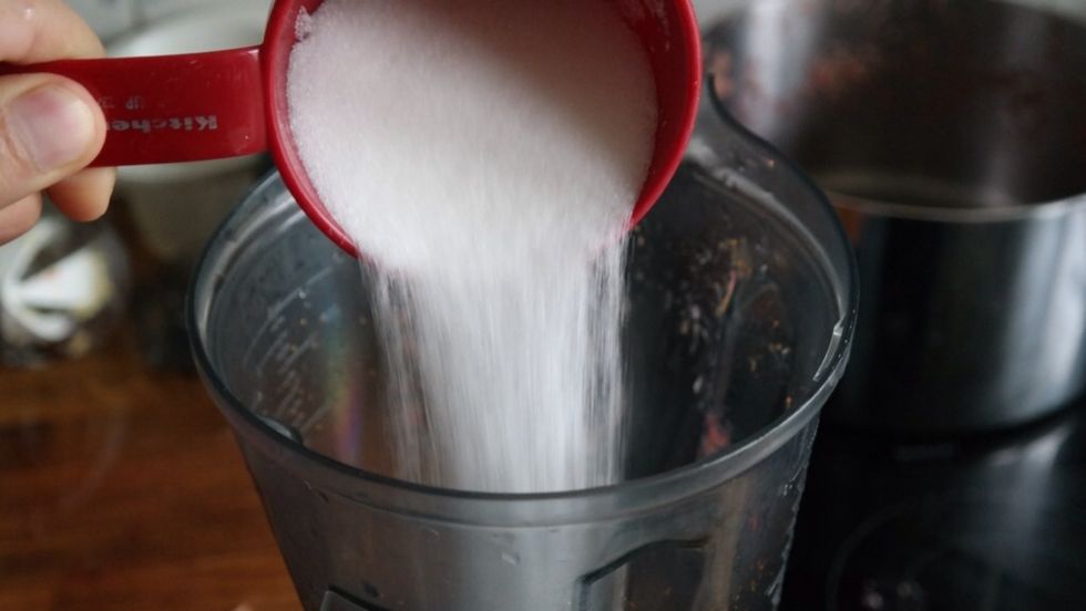 Add 2 cups of sugar to the strawberry pur\u00e9e after you have sieved it.
