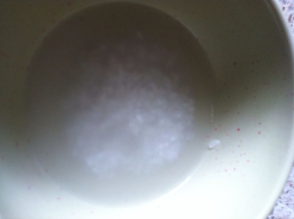 Add 2 cups of water to your 1 cup of rice. Let it sit for 5 mins. Then use your fork or spoon to stir. Stir for 1 min. Then drain your rice and put the water in the empty container.