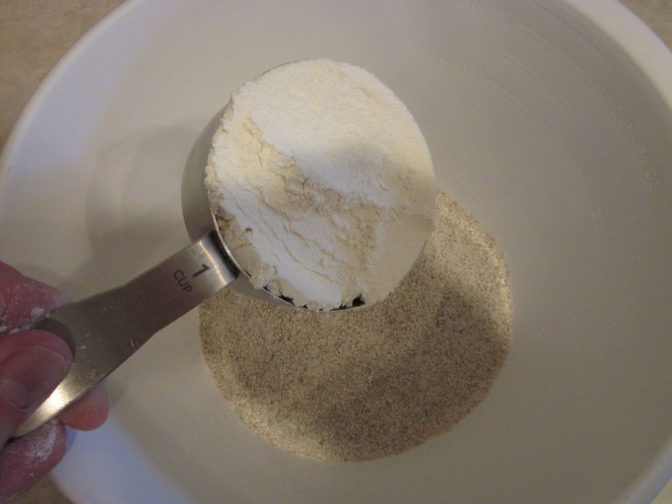 Add 2 Cups of White Bread Flour. Regular bleached flour would work but bread flour has better proteins and allows for increased elasticity when the dough rises. That right there was science.