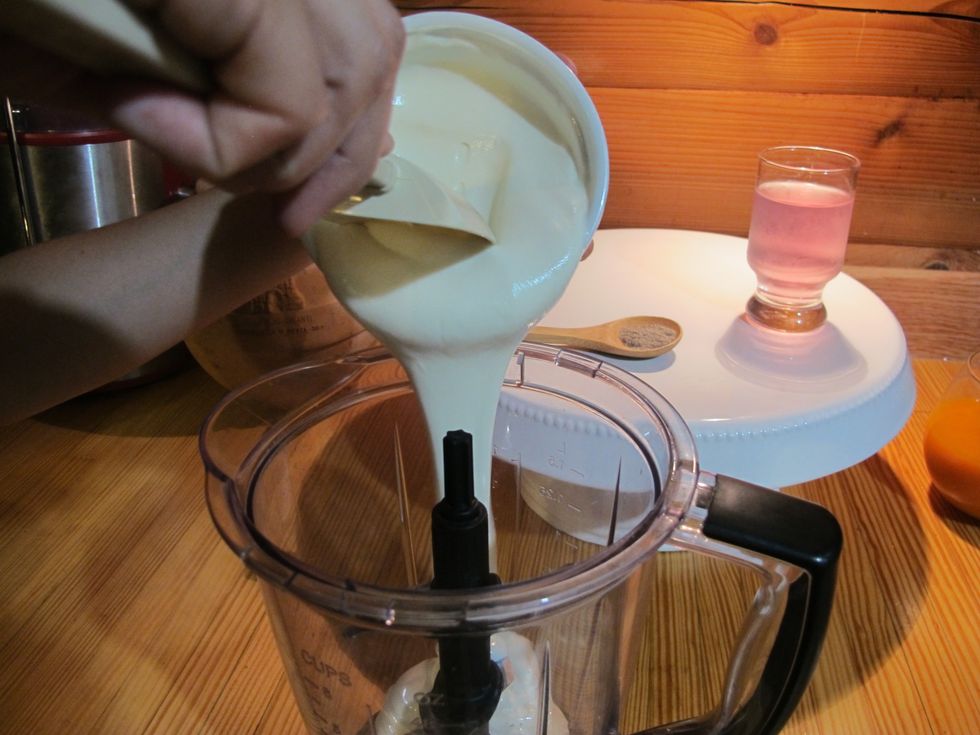 Add 2 cups of yogurt to blender.