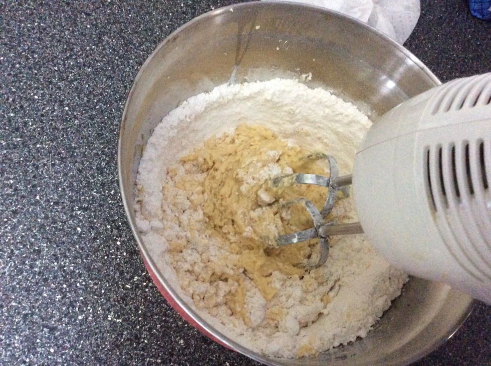 Add 2 egg yolks then add 1 teaspoon of vanilla and gradually beat in 2 cups of flour.