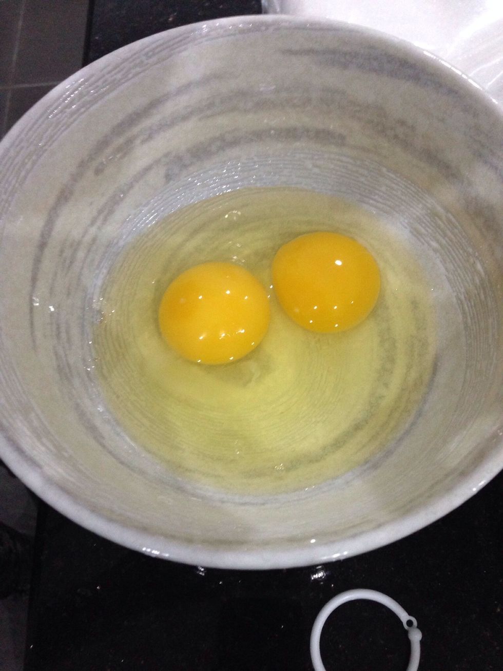 Add 2 eggs. 1 by 1