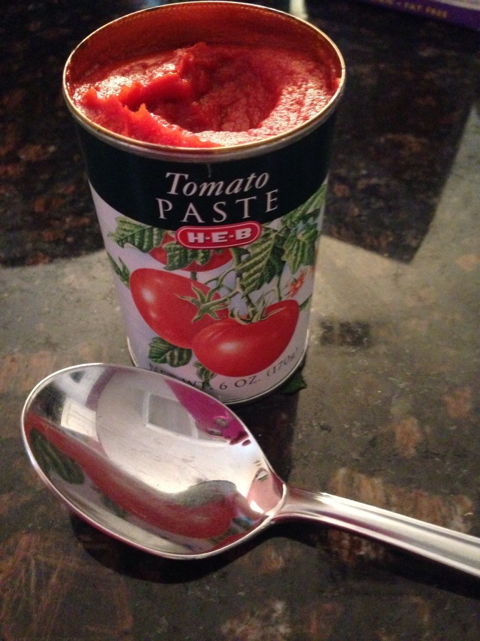 Add 2 heaping Tablespoons worth of tomato paste to the pot and mix.