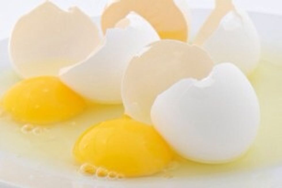 Add 2 large eggs to the mixture.