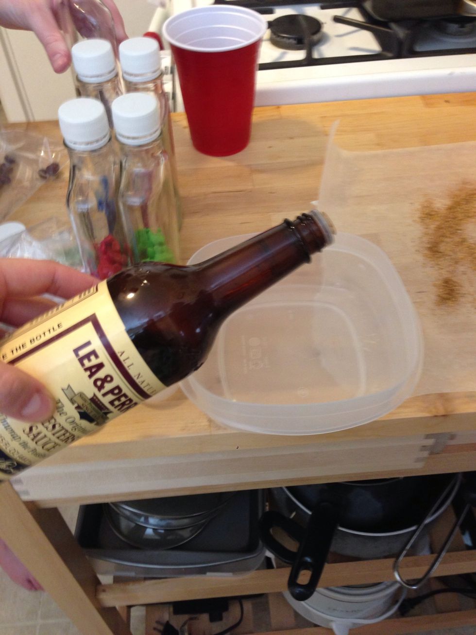 Add 2 oz of Worcestershire sauce to a container.