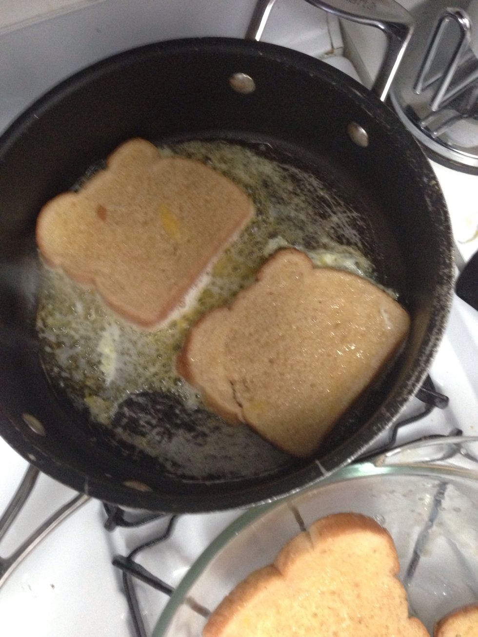 Add 2 slices of coated bread to the pan. Cook about 2 minutes per side until brown. Keep an eye on it, it can get black and burnt fairly quickly. Then start on the next 2 slices with remaining butter.