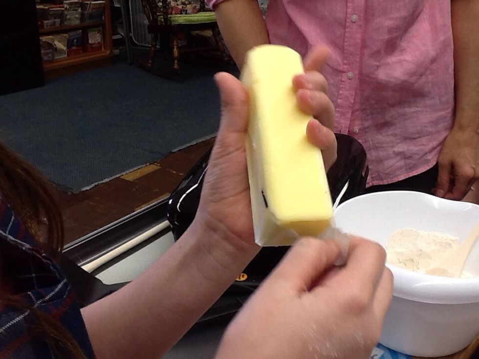 Add 2 softened sticks of butter to a separate bowl and beat until soft.