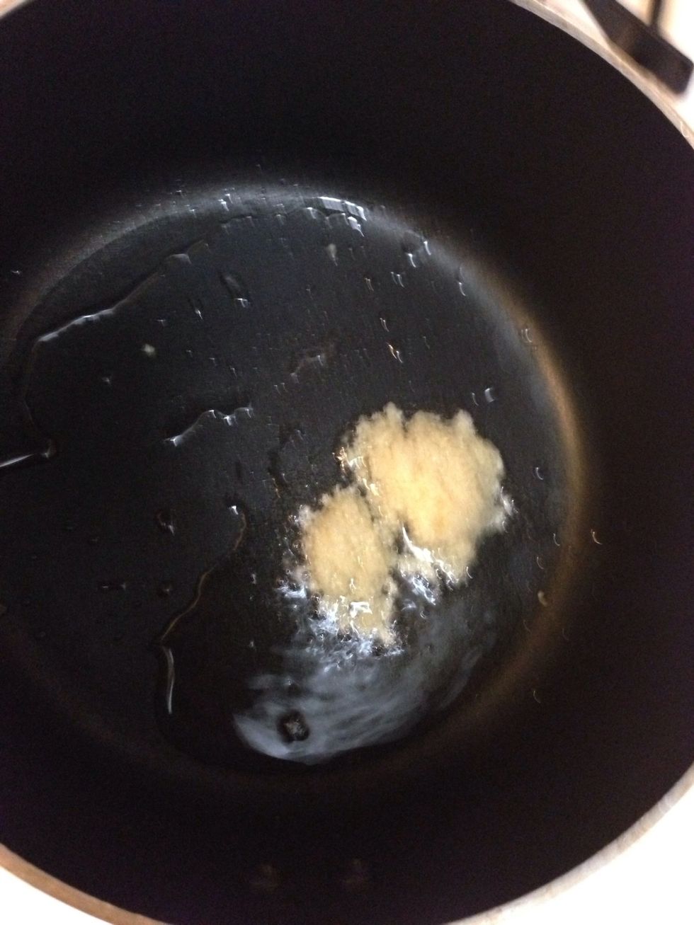 Add 2 table spoon of oils and garlic