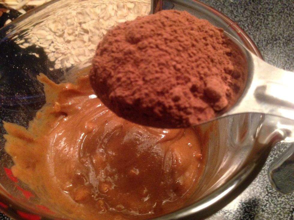 Add 2 table spoons of organic unsweetened cocoa powder to measuring cup containing almond butter, honey, maple syrup and vanilla extract mixture