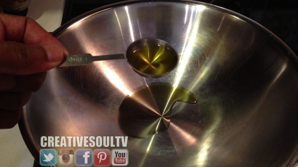 Add 2 Tablespoons of extra virgin olive oil into your pan or wok.
