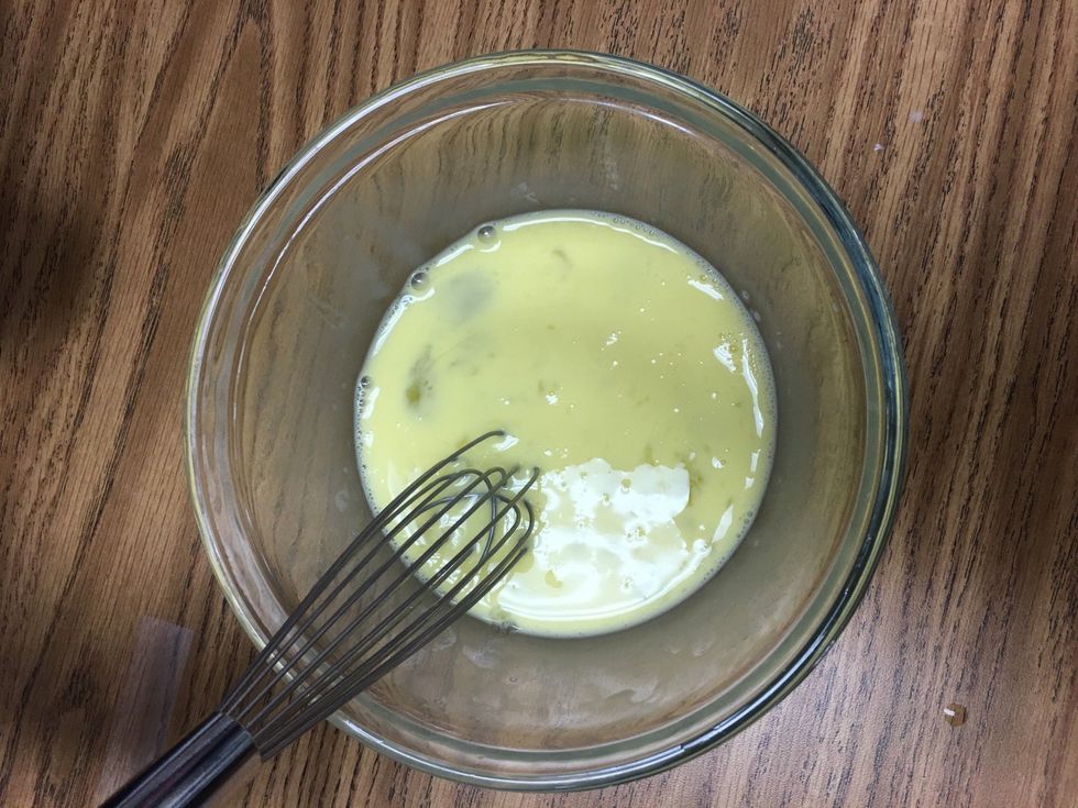 Add 2 tablespoons of milk and whisk.