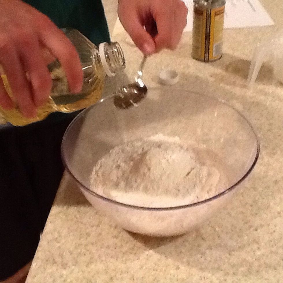 Add 2 tablespoons of vegetable oil into the mixing bowl or blender