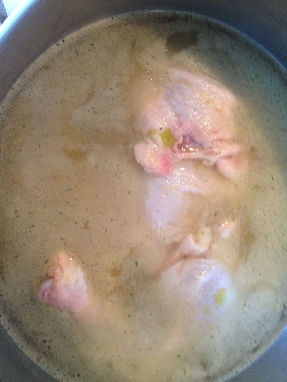 Add 2 Tbs of Boullion & 1 can of green chilies to the chicken. Turn on stove & cook until chicken falls off the bone.